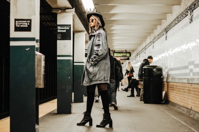 girl in new york city getting on train