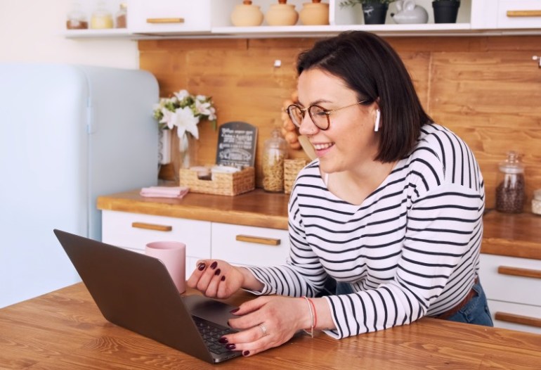 woman using the clickup app to organize her life