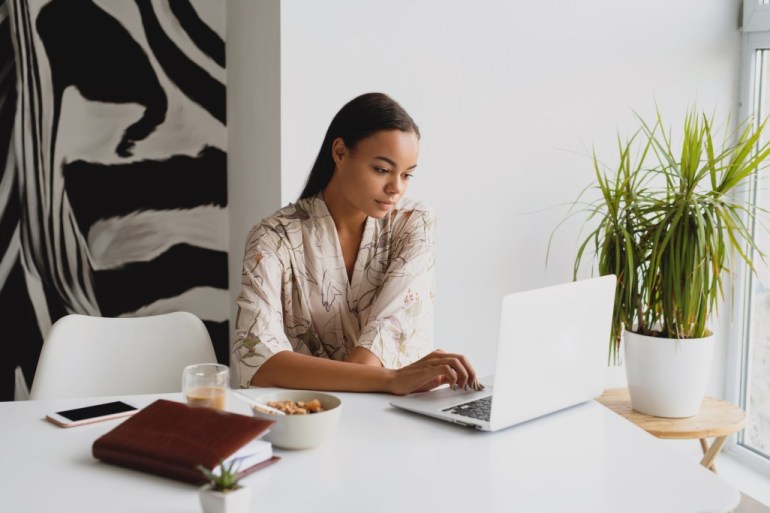 Black woman focusing during her work day