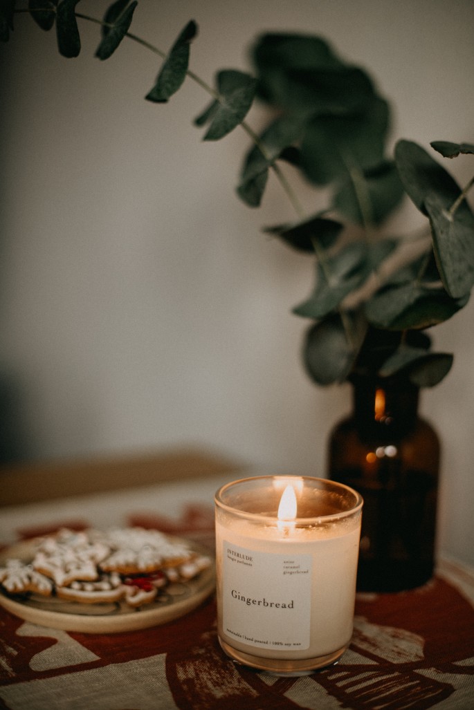 Candle lit for self-care ritual ambiance