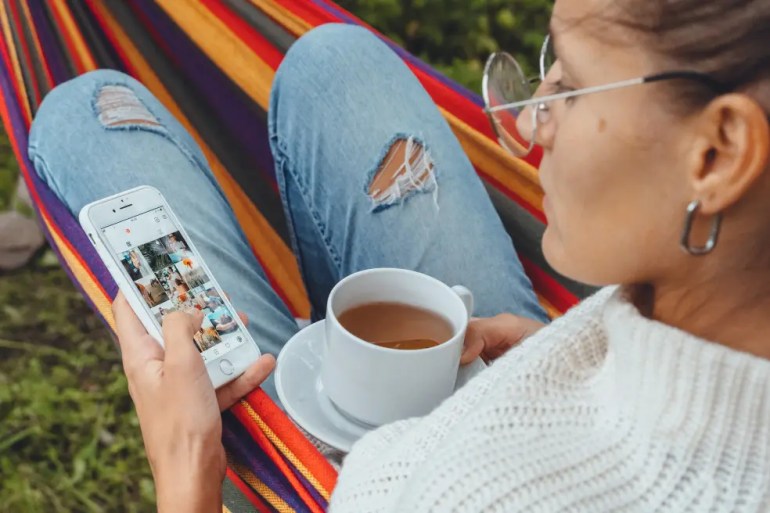 woman on phone before a social media fast