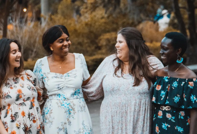 women celebrating each other at success shower